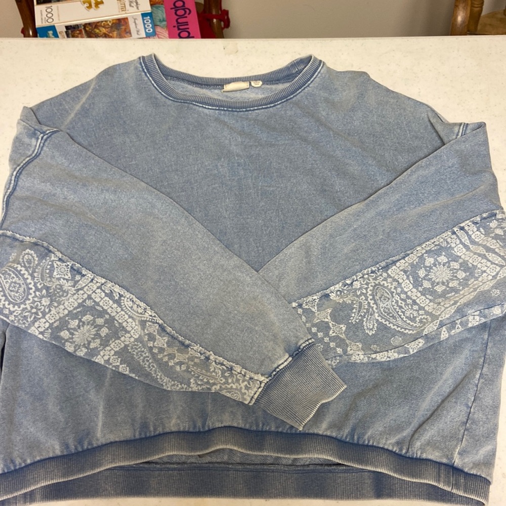 A blue crewneck